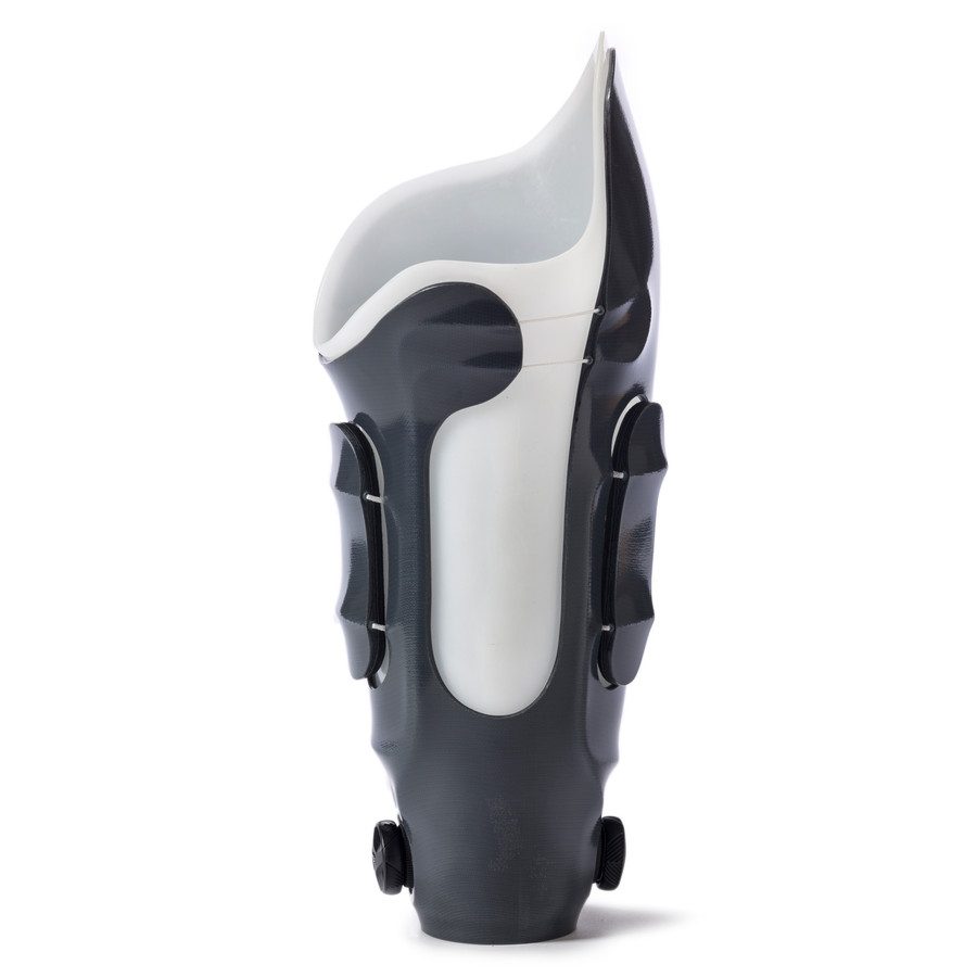 An adjustable prosthetic socket with a dial-based RevoFit tightening system.